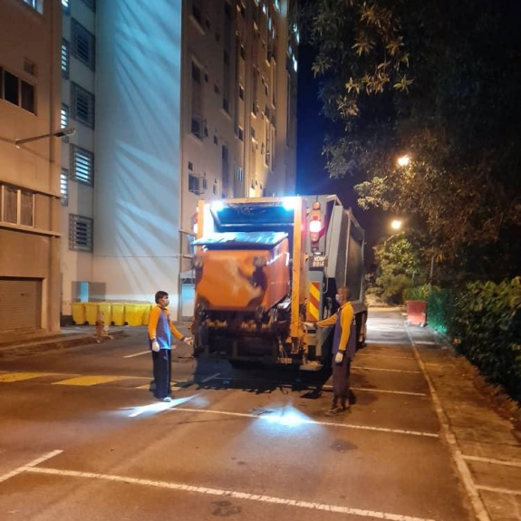 Garbage collection using compactor lorry equipped with mechanical lifter at Lodge Residence, Putra Nilai